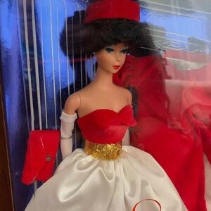 Elegant Red and White Doll with Gold Accents